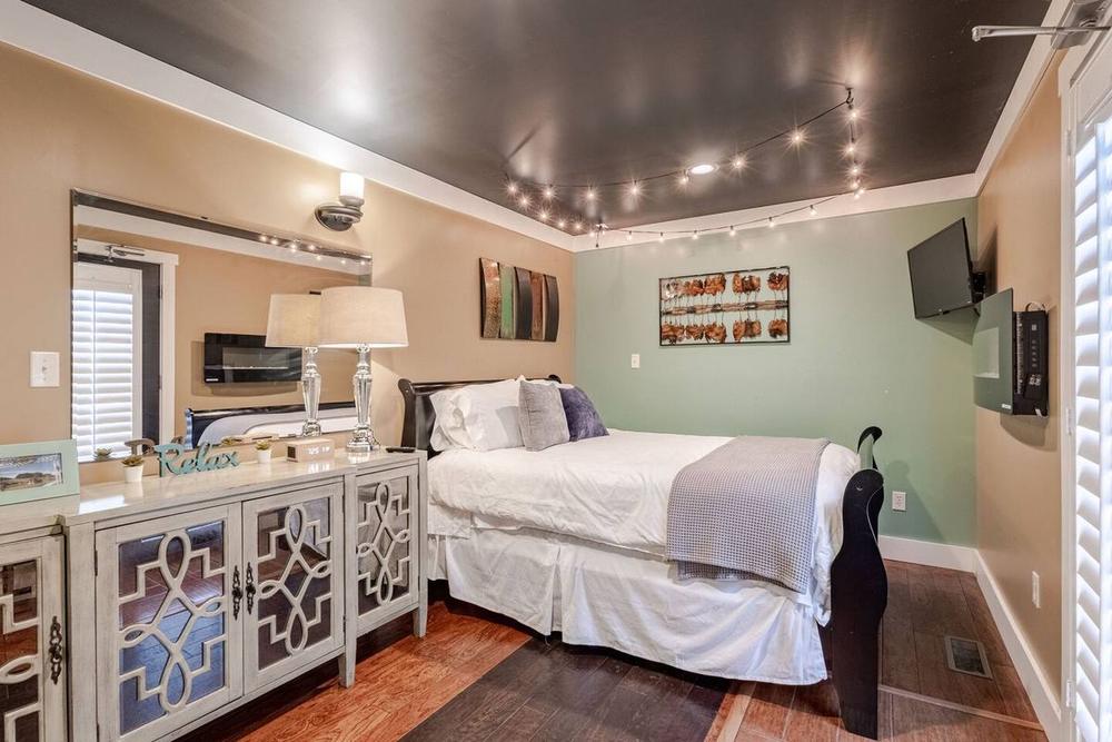 Third Milkbarn ready room with mirrored dresser and champagne chandelier