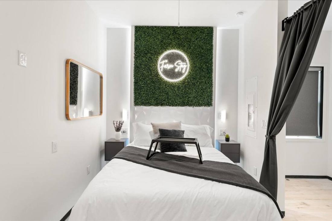 A modern one-bedroom barndo suite bedroom at Cedar Pond Farms, minutes from Carson-Newman University