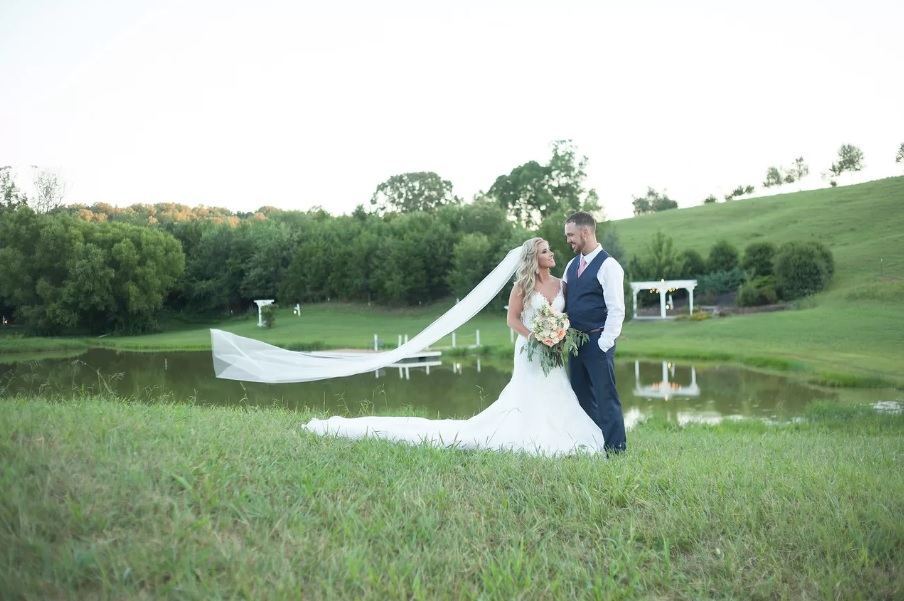 The Little Meadow at Cedar Pond Farms, an open venue field with pasture beyond