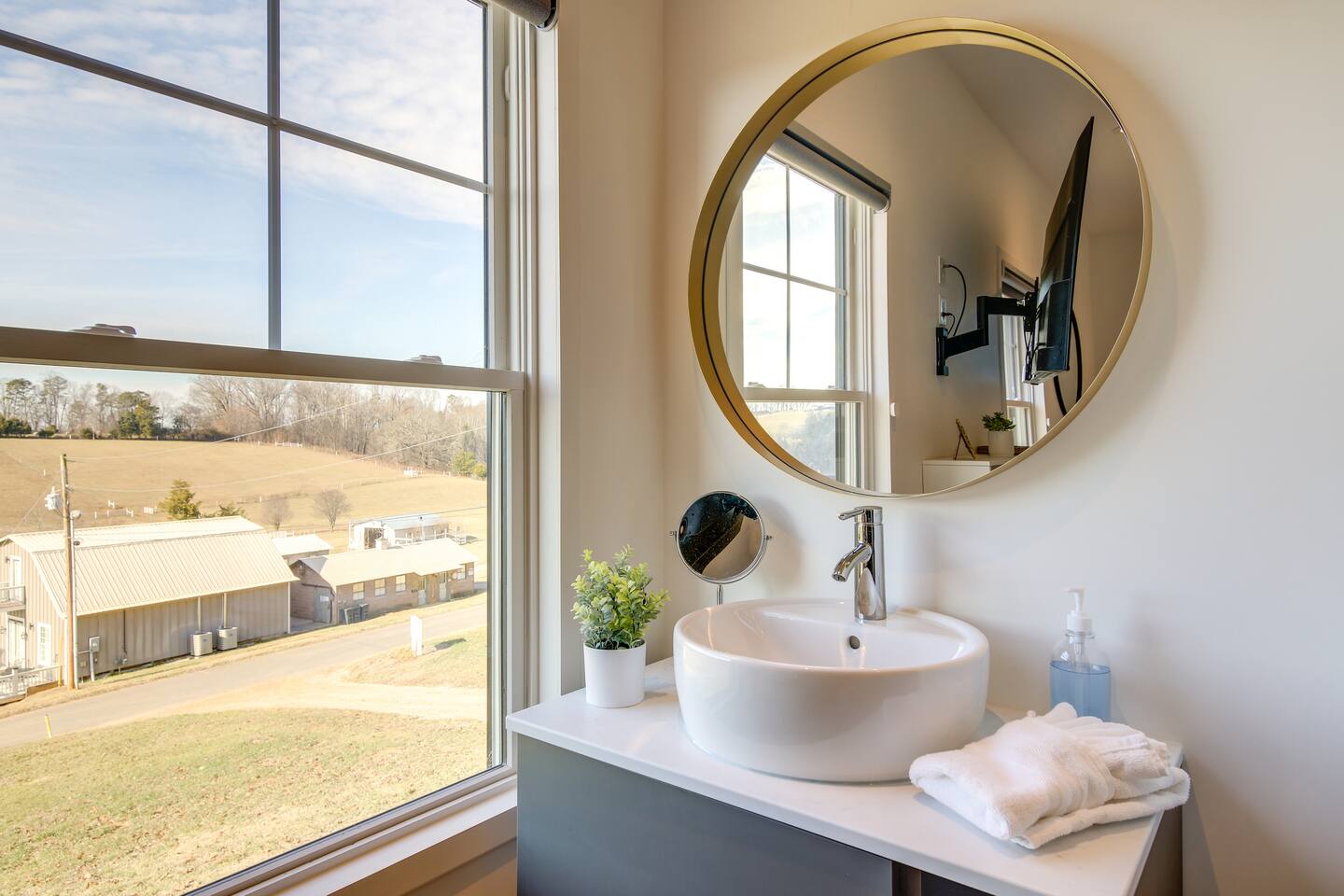 Barndo 2B at Cedar Pond Farms in Jefferson City — a three-bedroom barndominium on a working farm with Scottish Highland cattle.