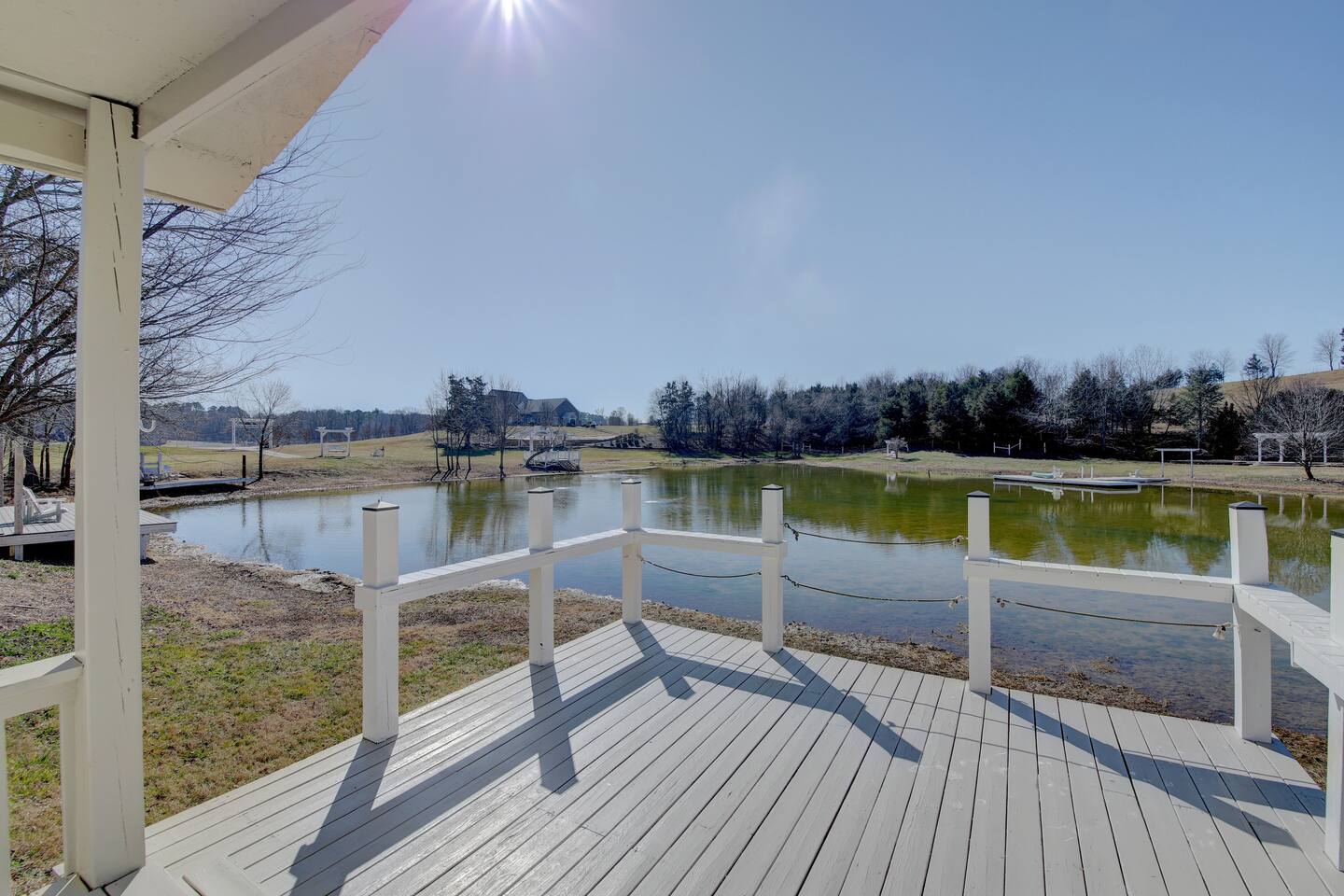 FishHouse Tiny Home at Cedar Pond Farms in New Market — a lakeside tiny home on a working farm with Scottish Highland cattle.