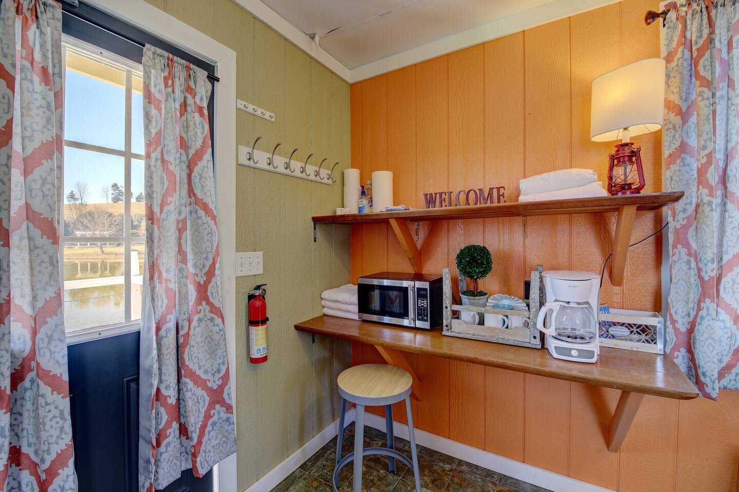 FishHouse Tiny Home at Cedar Pond Farms — lakeside tiny home lodging on the farm, with the Highland herd a short walk away.